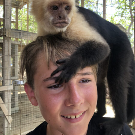 Easton, the Monkey, and the Macaws